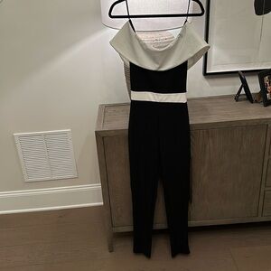 Quiz Black and white off the shoulder jumpsuit size 4. NWT